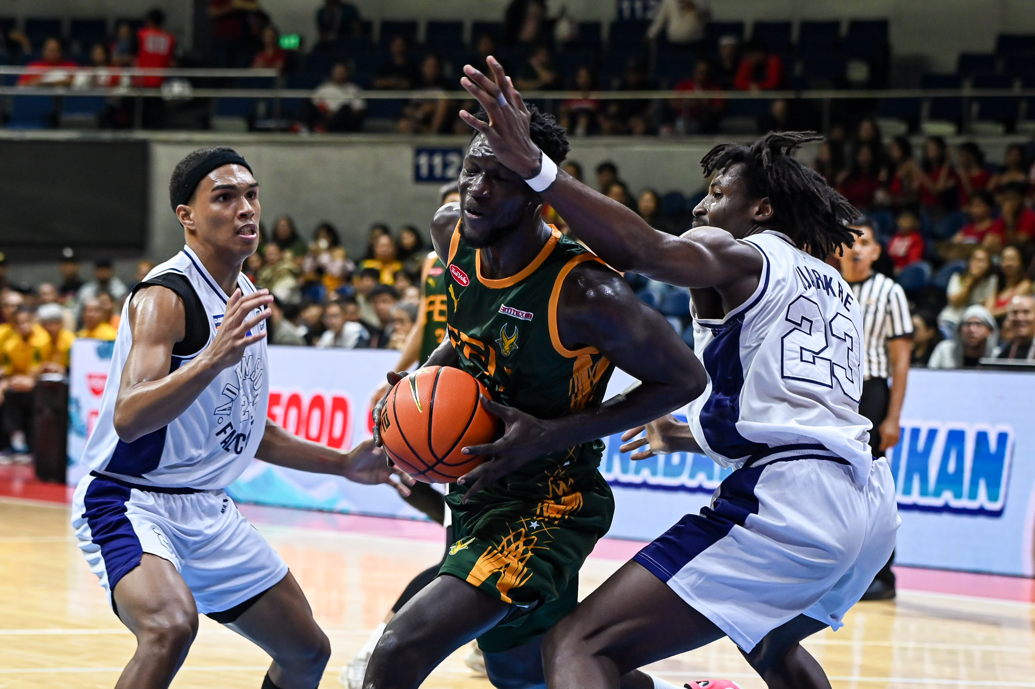 FEU's Mo Konateh against Adamson's OJ Ojarikre