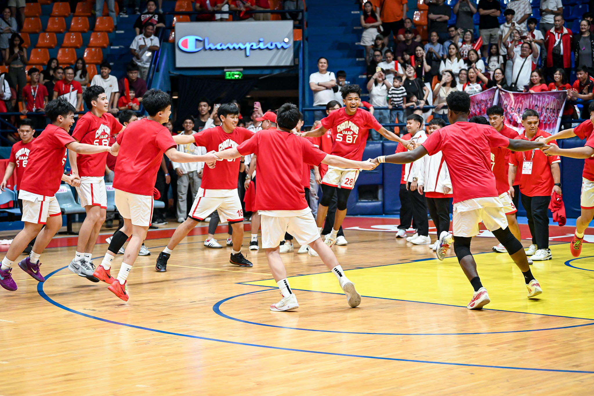 The UE Junior Red Warriors celebrating their UAAP Season 87 title.