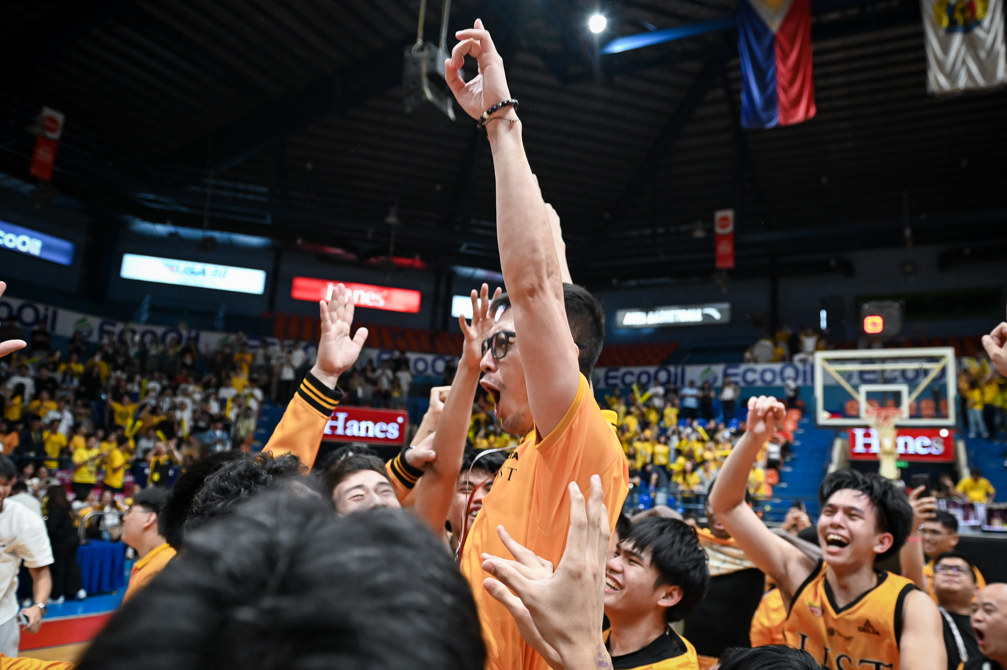 UST head coach Manu Iñigo getting the traditional victory ride after winning the Tiger Cubs' 12th UAAP Boys' Basketball championship.